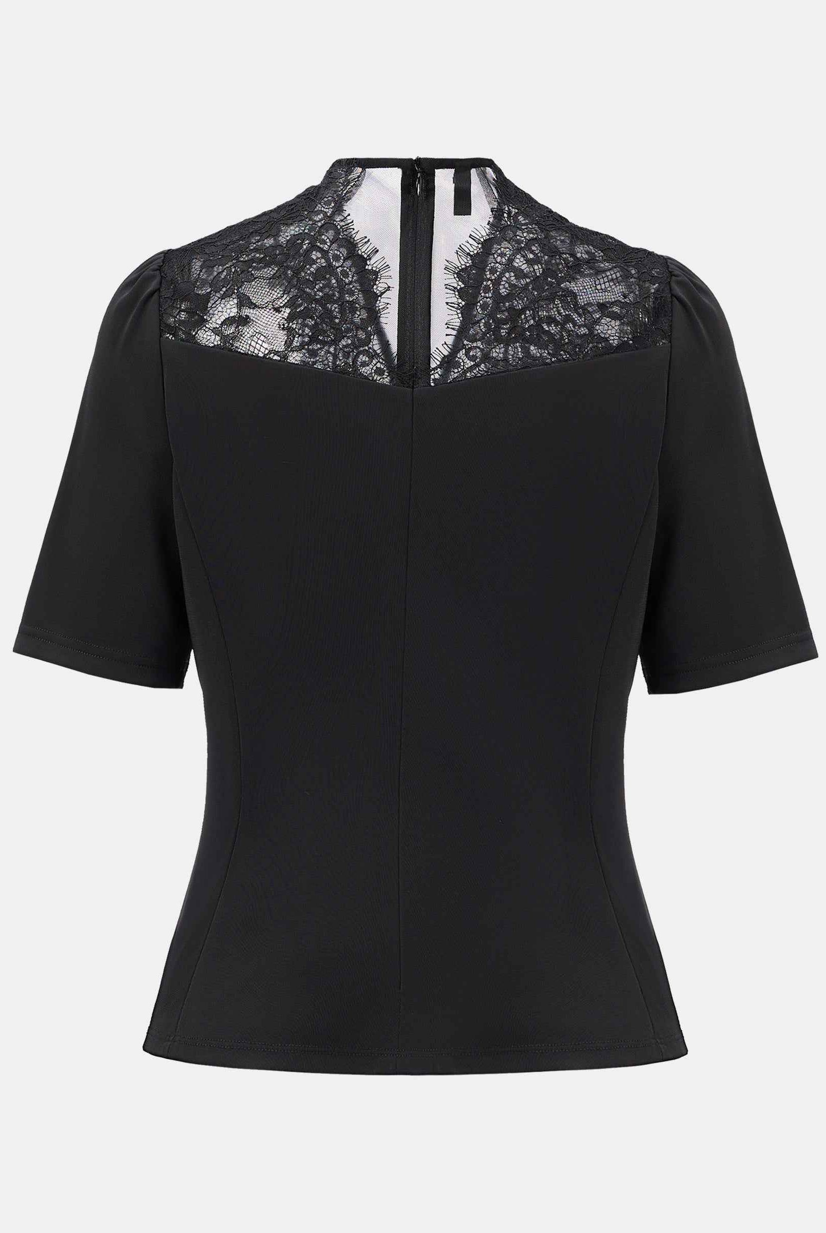 Chinese-inspired short-sleeve blouse with a tailored waist