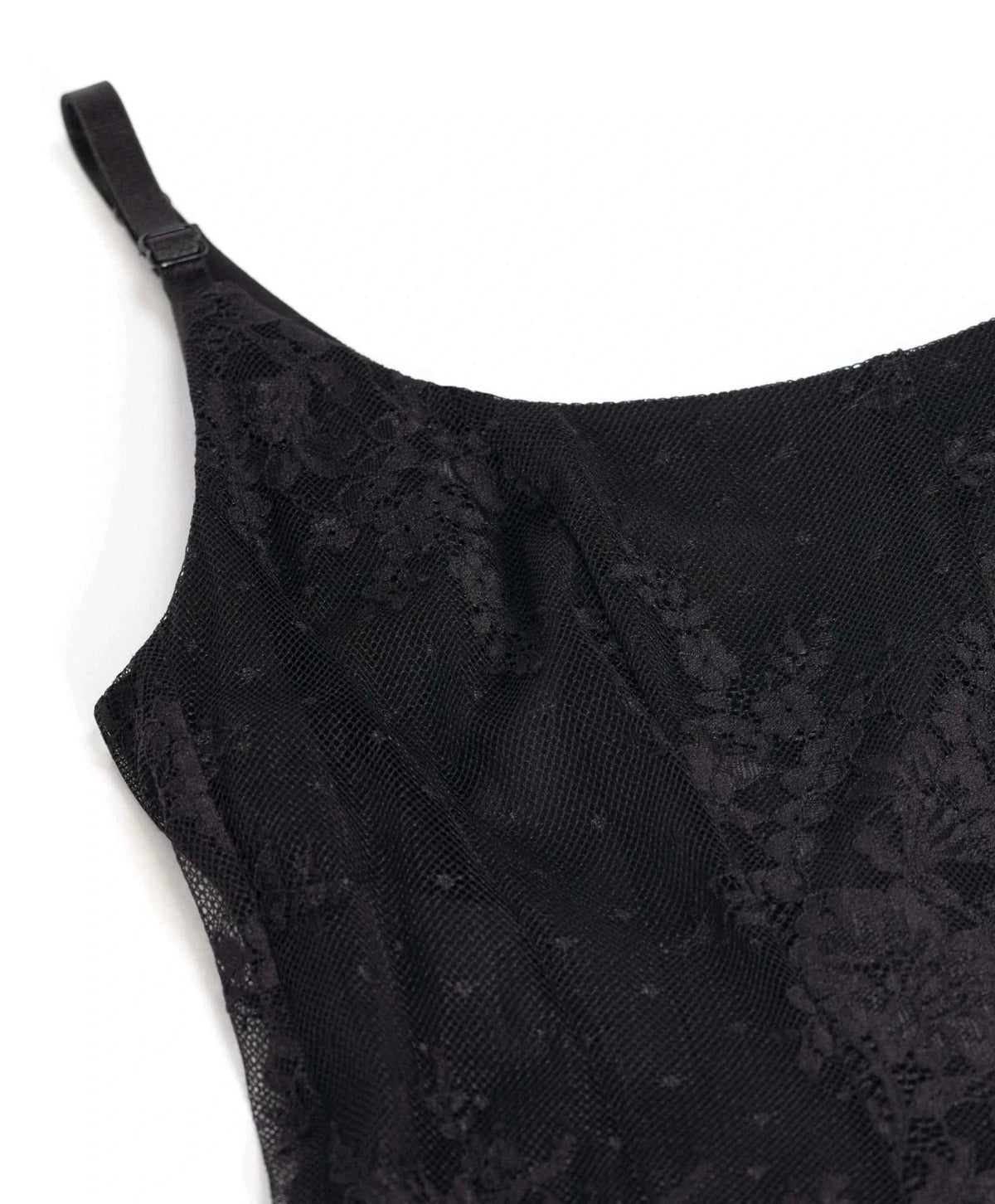 Fine shoulder straps meet a gently curved upper edge above the floral lace.