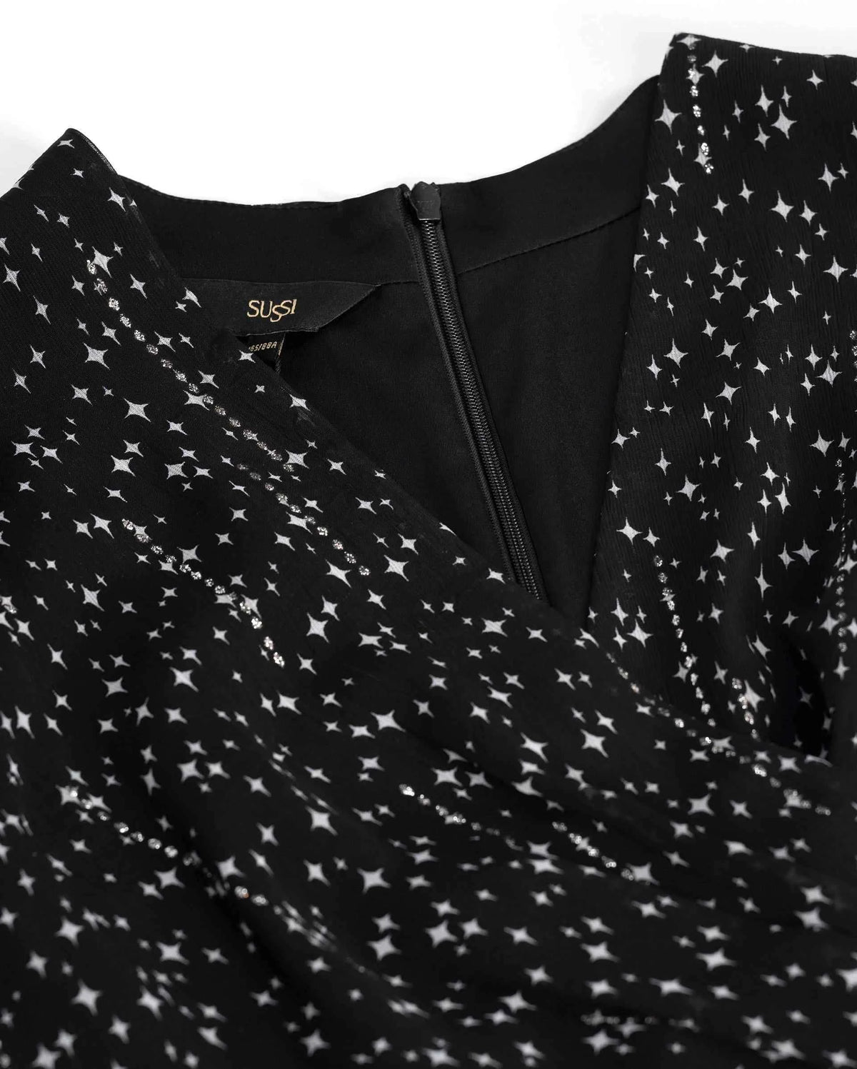 The upper section crosses diagonally beneath a softly shaped neckline, giving the bodice a wrapped appearance.