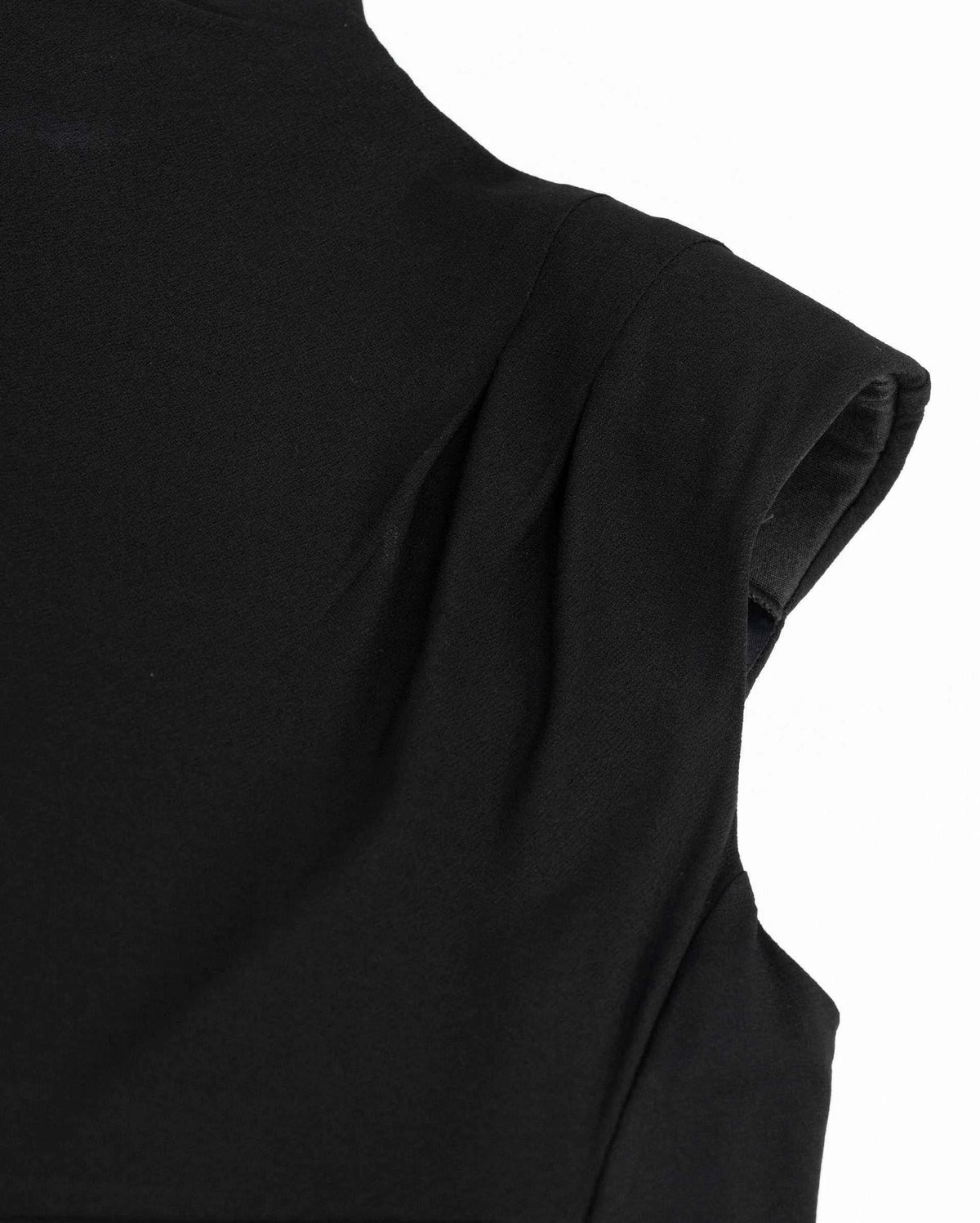 The shoulder extends into a small cap above the arm, with gathering visible near its edge.