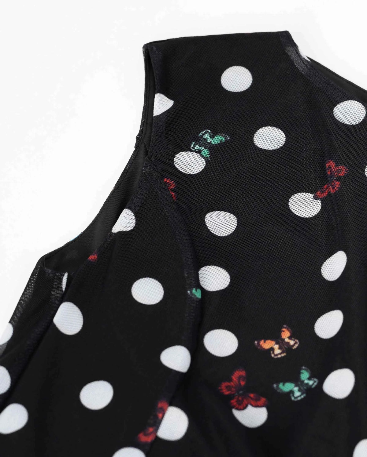 The sleeveless upper section follows a clear curve around the arm opening.