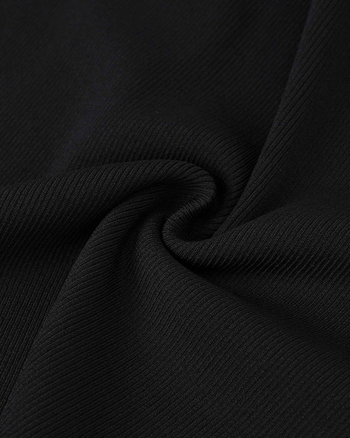 The close-up shows a fine, even knit, with soft folds creating subtle changes in light.