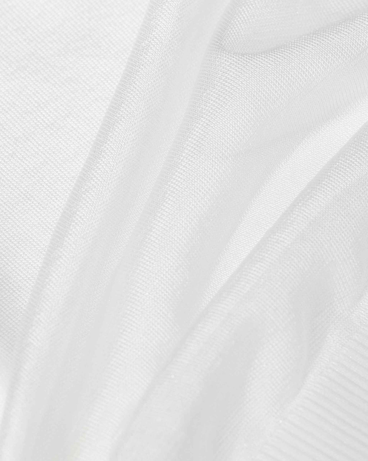 Closely spaced knit lines become visible along the folds of the ivory fabric.