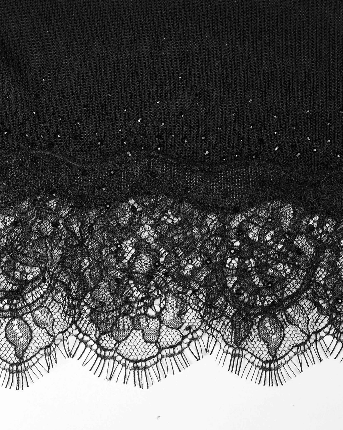 Floral lace extends beneath the body of the blouse, with a narrow line of reflective details above.