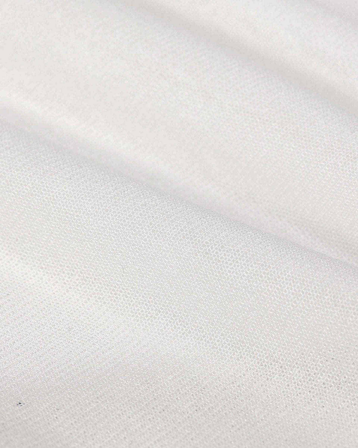 The pale knit folds into a smooth, softly lit surface with a fine texture visible close up.