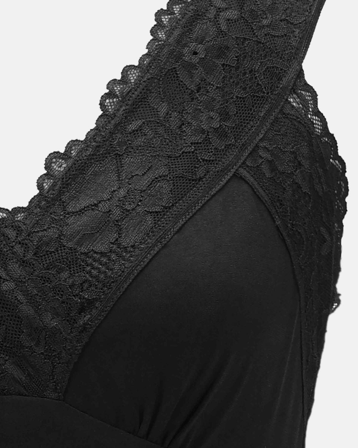 Wide lace sections rise from the neckline to form the shoulder line.