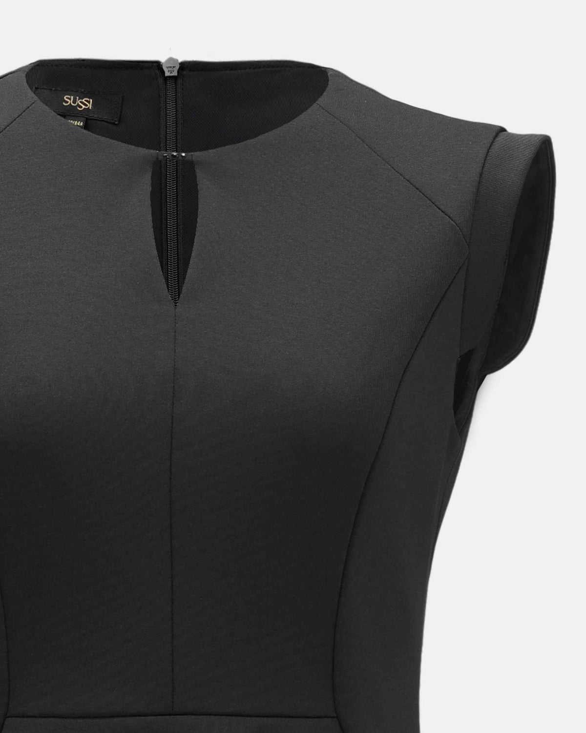 The neckline detail reveals a small opening above the back fastening.