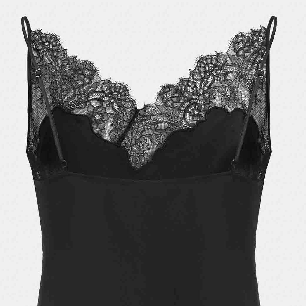 Floral lace rises above the camisole's opaque body to form a delicate neckline.