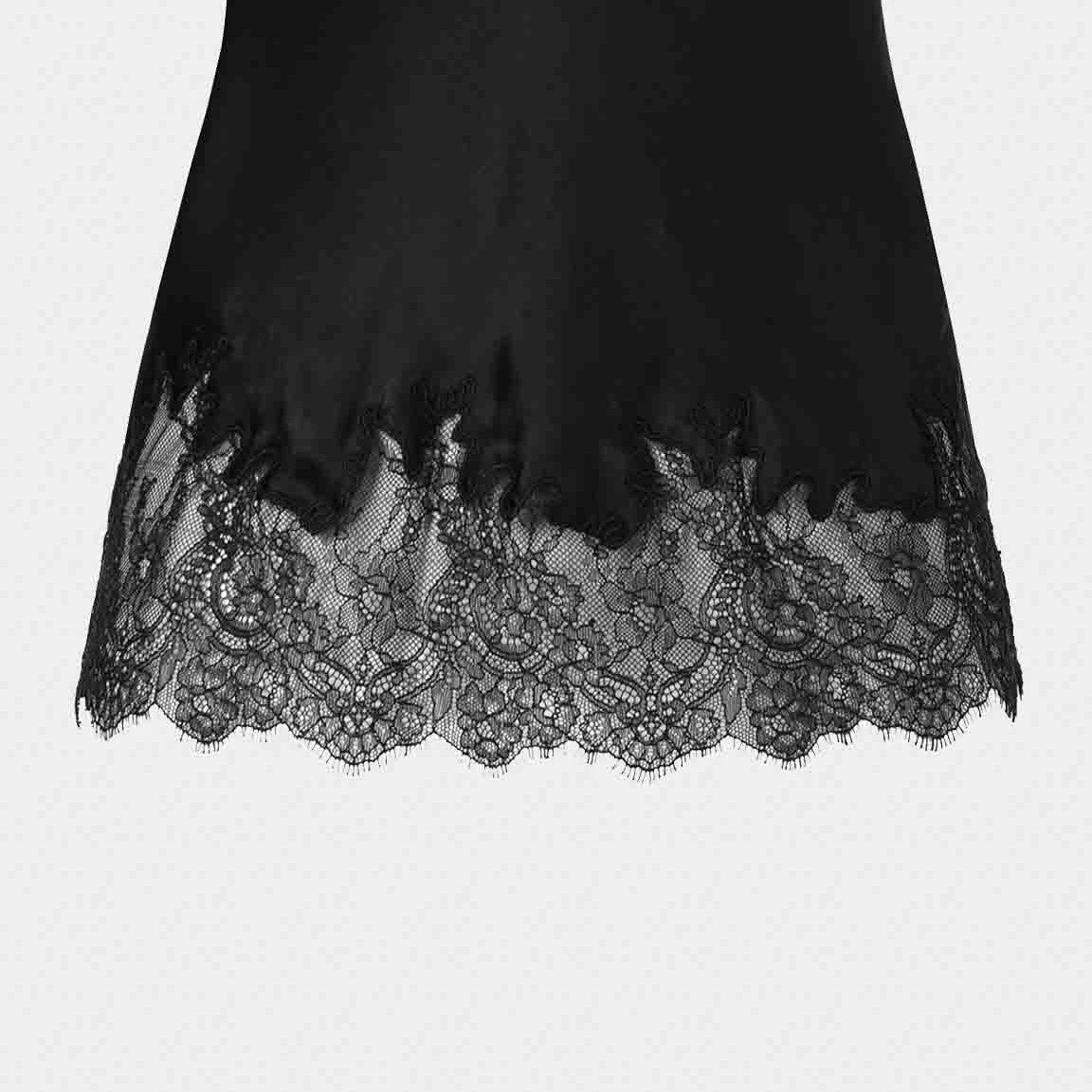 The camisole's lower edge finishes in floral lace, repeating the decoration at the neckline.