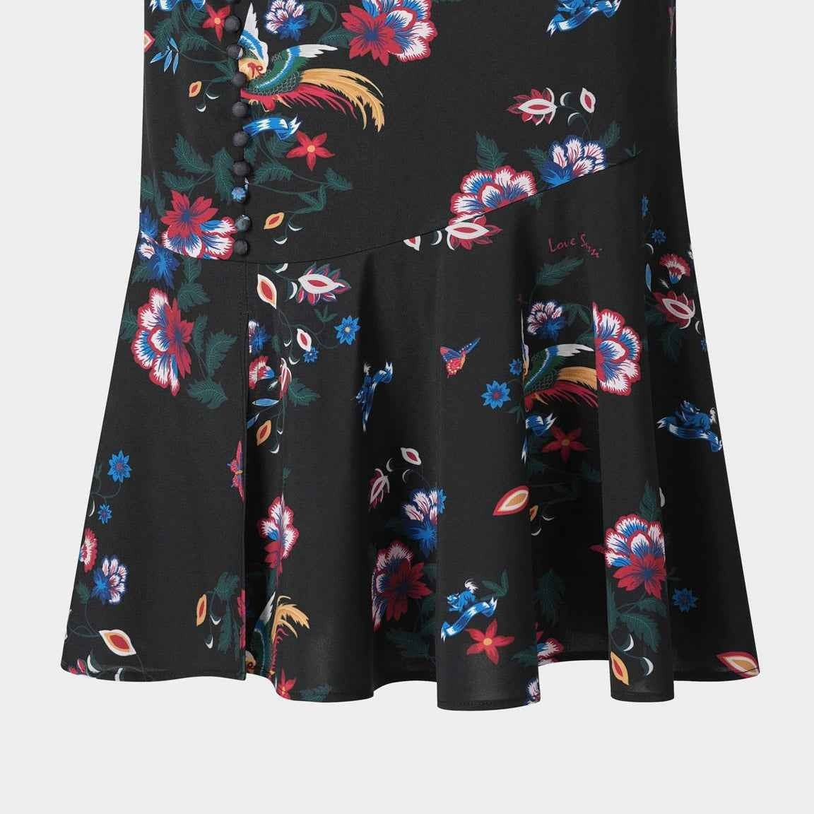 The skirt's flounced lower section opens out beneath a more closely shaped upper line.