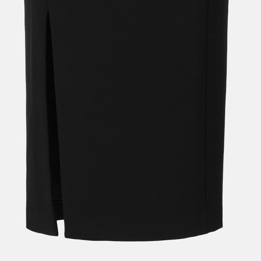 A narrow opening interrupts the skirt's otherwise straight lower edge.