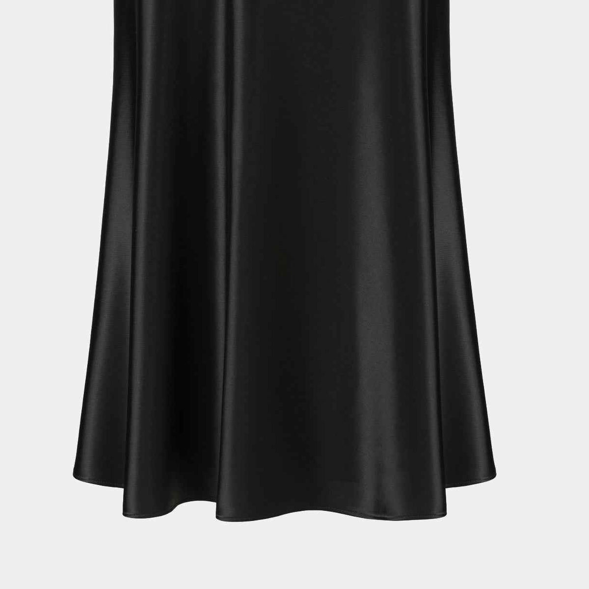 The skirt opens into a wider lower edge beneath a smooth upper section.